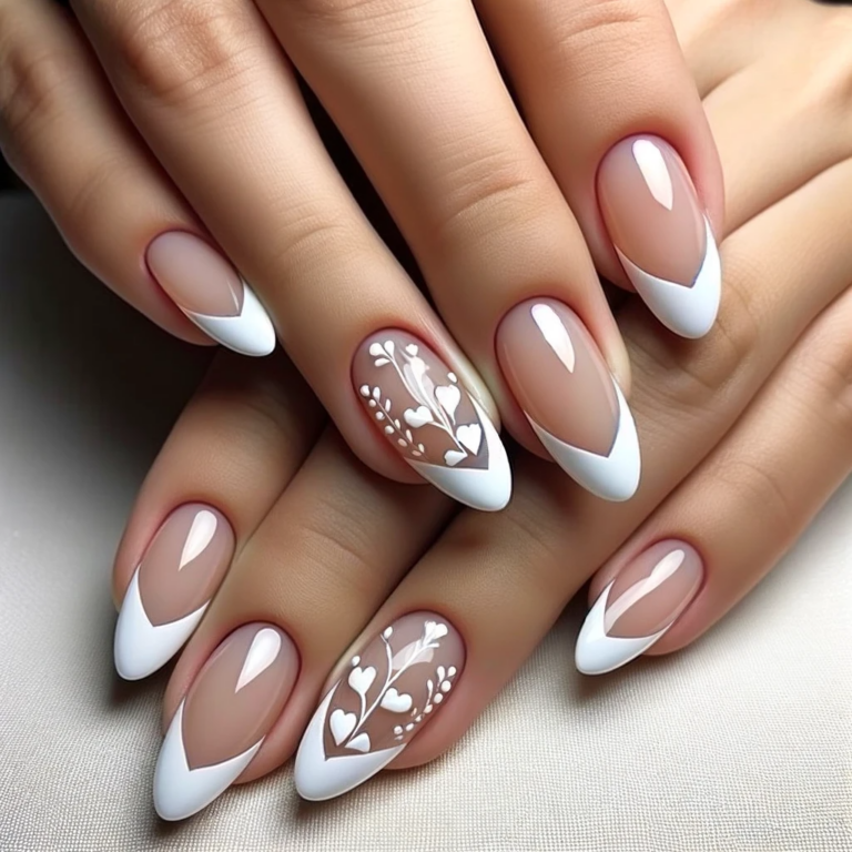 A set of elegant French tip almond-shaped nails designed for Valentine's Day. The nails feature a classic French tip style with a twist - each nail is